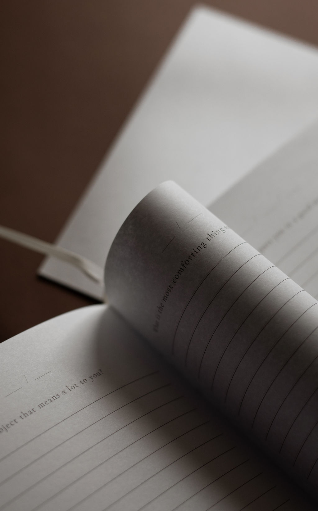 Open journal with reflective prompts